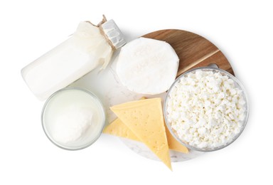 Photo of Different fresh dairy products isolated on white, top view