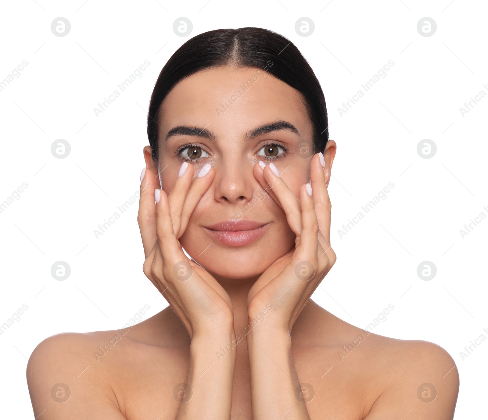 Photo of Beautiful young woman touching skin around eyes on white background