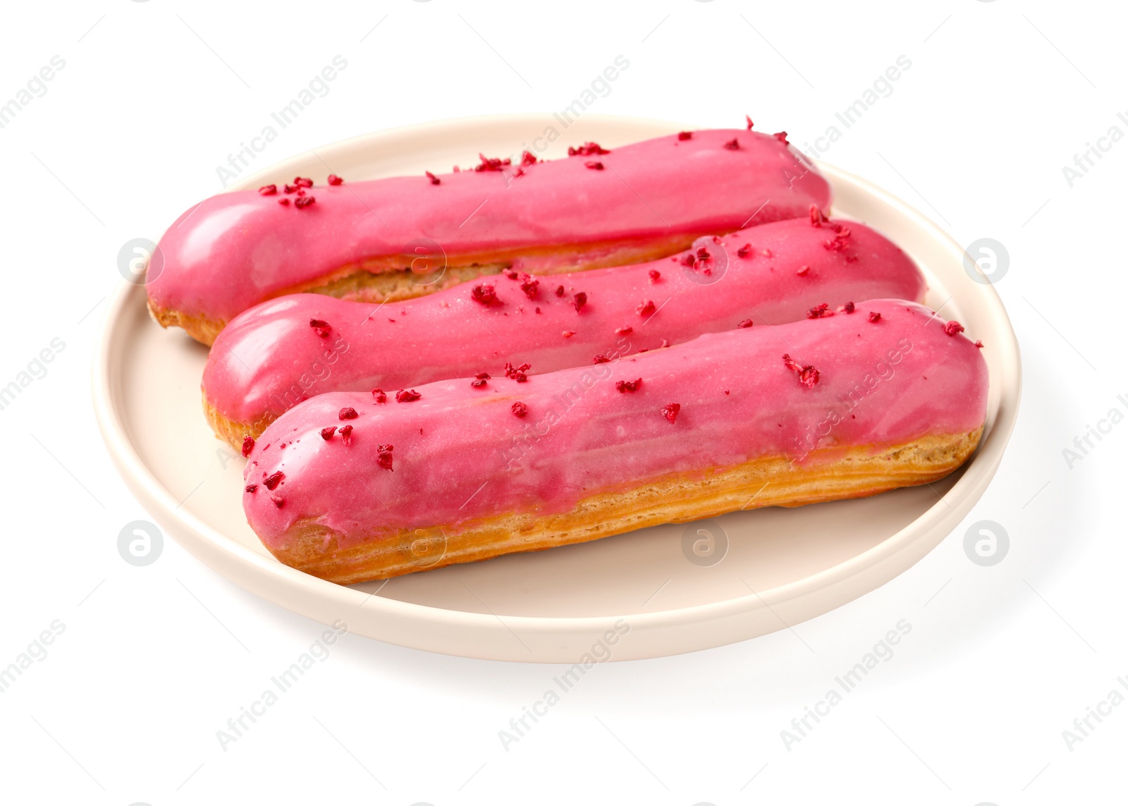 Photo of Delicious eclairs covered with pink glaze isolated on white