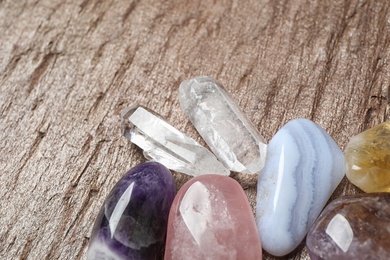 Photo of Different beautiful gemstones on textured brown surface