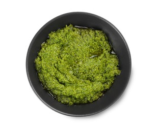 Photo of Fresh tasty pesto sauce isolated on white, top view