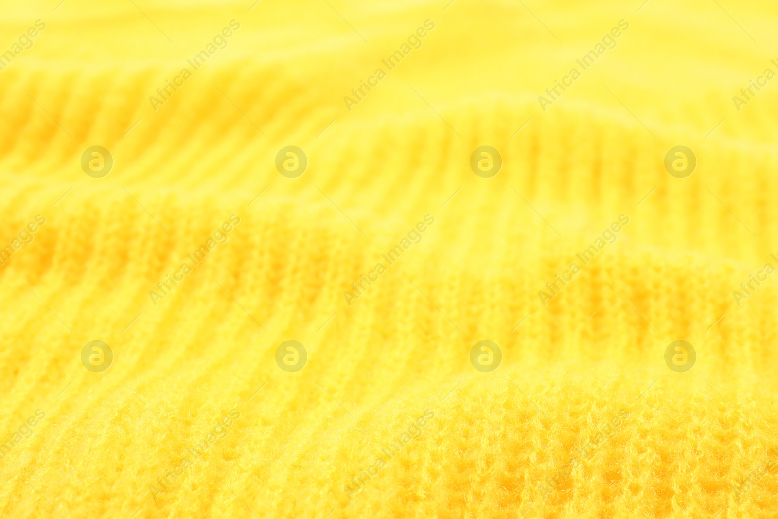 Photo of Texture of cozy warm sweater as background, closeup