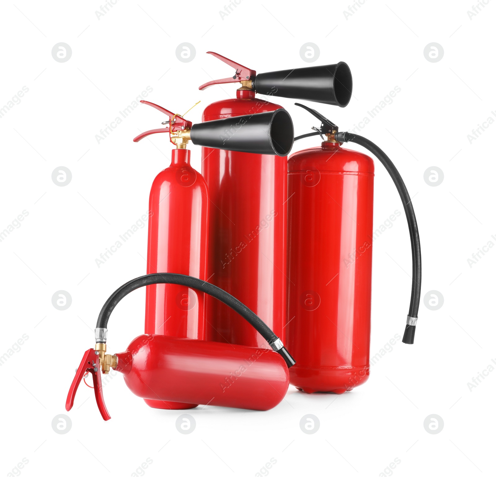 Photo of Many red fire extinguishers on white background