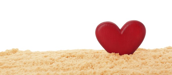 Photo of Honeymoon concept. Red wooden heart and sand isolated on white