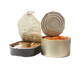 Photo of Open tin cans of fish in tomato sauce and sprats isolated on white