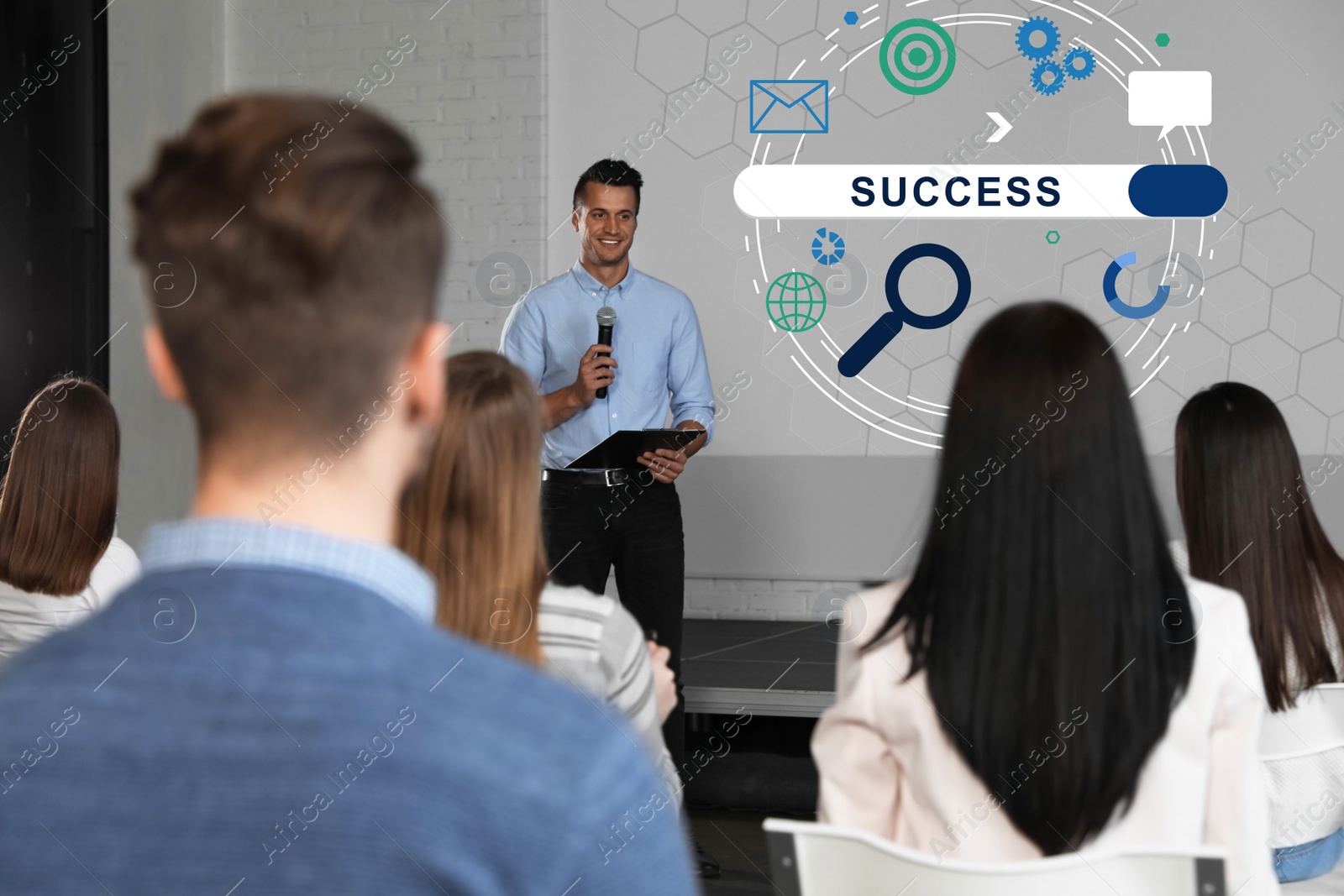 Image of Business trainer giving lecture in conference room with projection screen