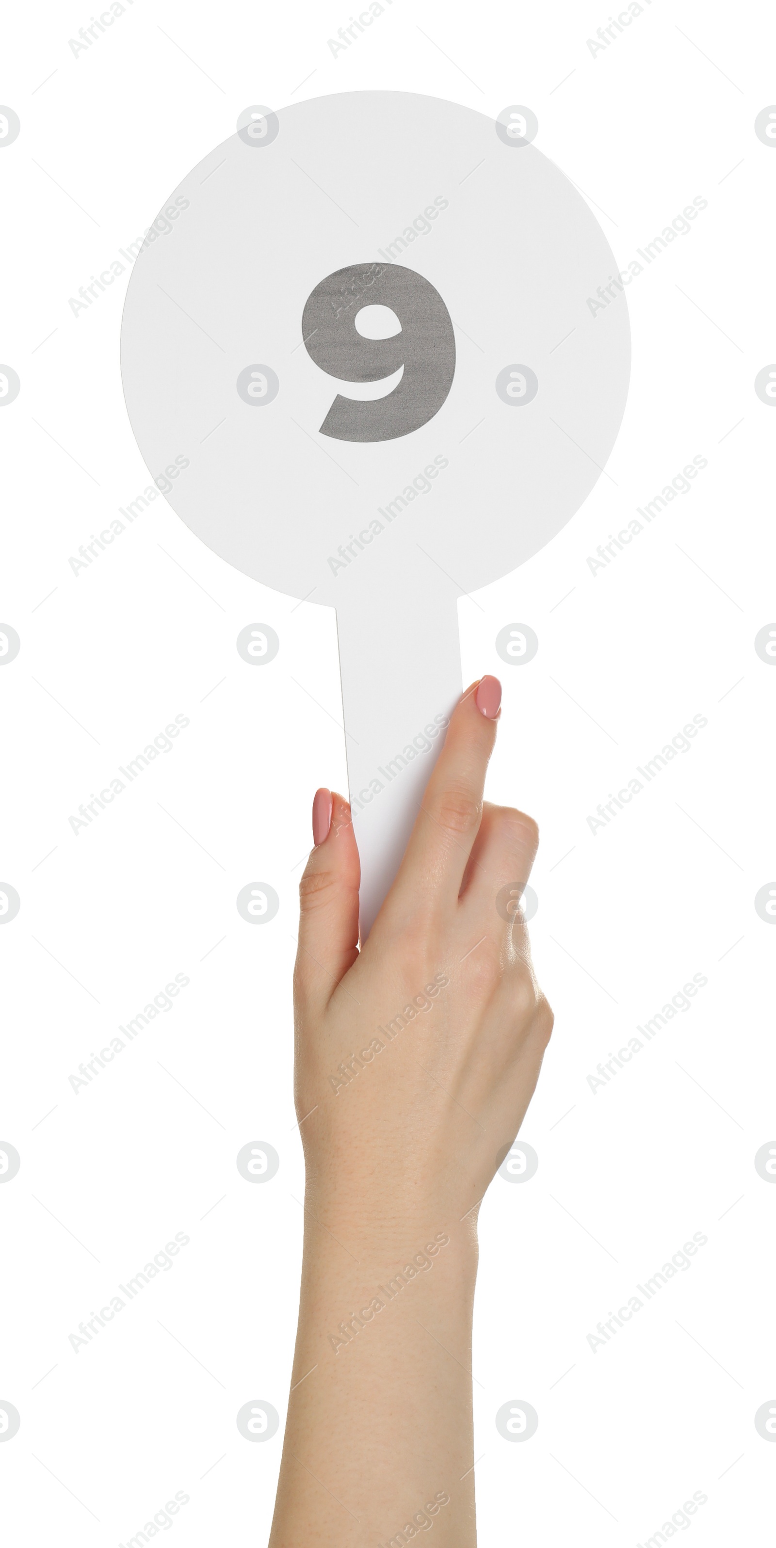 Photo of Woman holding auction paddle with number 9 on white background, closeup