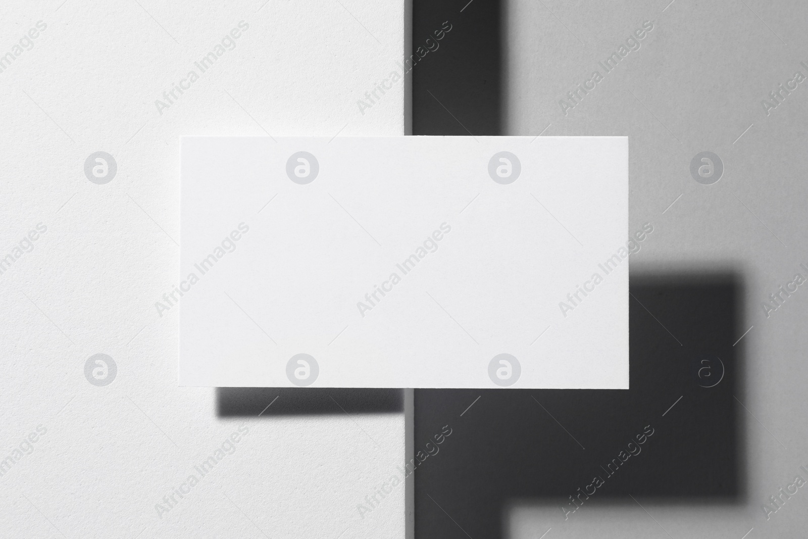 Photo of Empty business card on white background, top view. Mockup for design