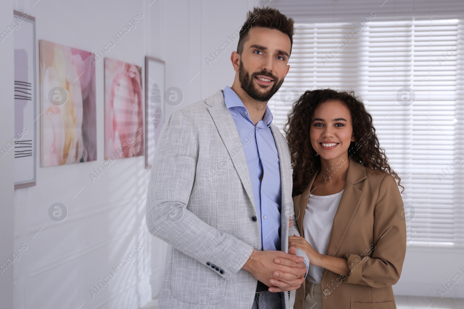 Photo of Happy couple at exhibition in art gallery