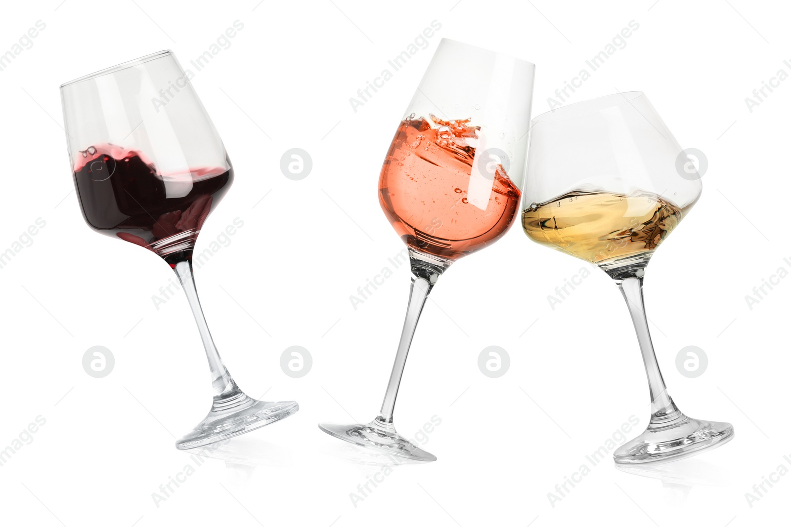 Image of Different types of wine splashing in glasses on white background