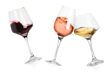 Image of Different types of wine splashing in glasses on white background