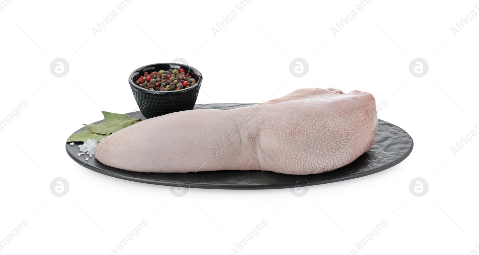 Photo of Serving board with raw beef tongue, peppercorns and bay leaves on white background