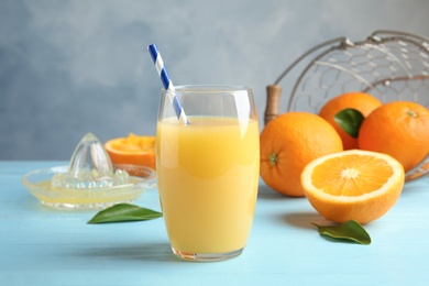 Photo of Composition with orange juice and fresh fruit on table