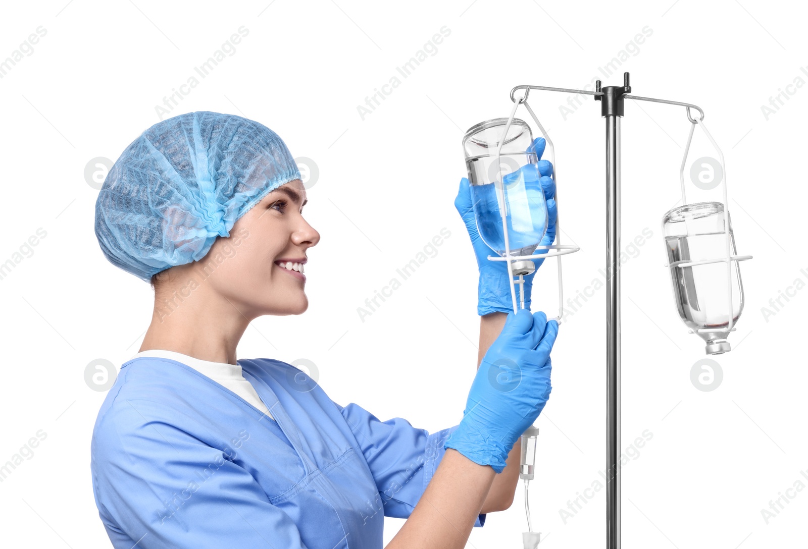 Photo of Nurse setting up IV drip on white background