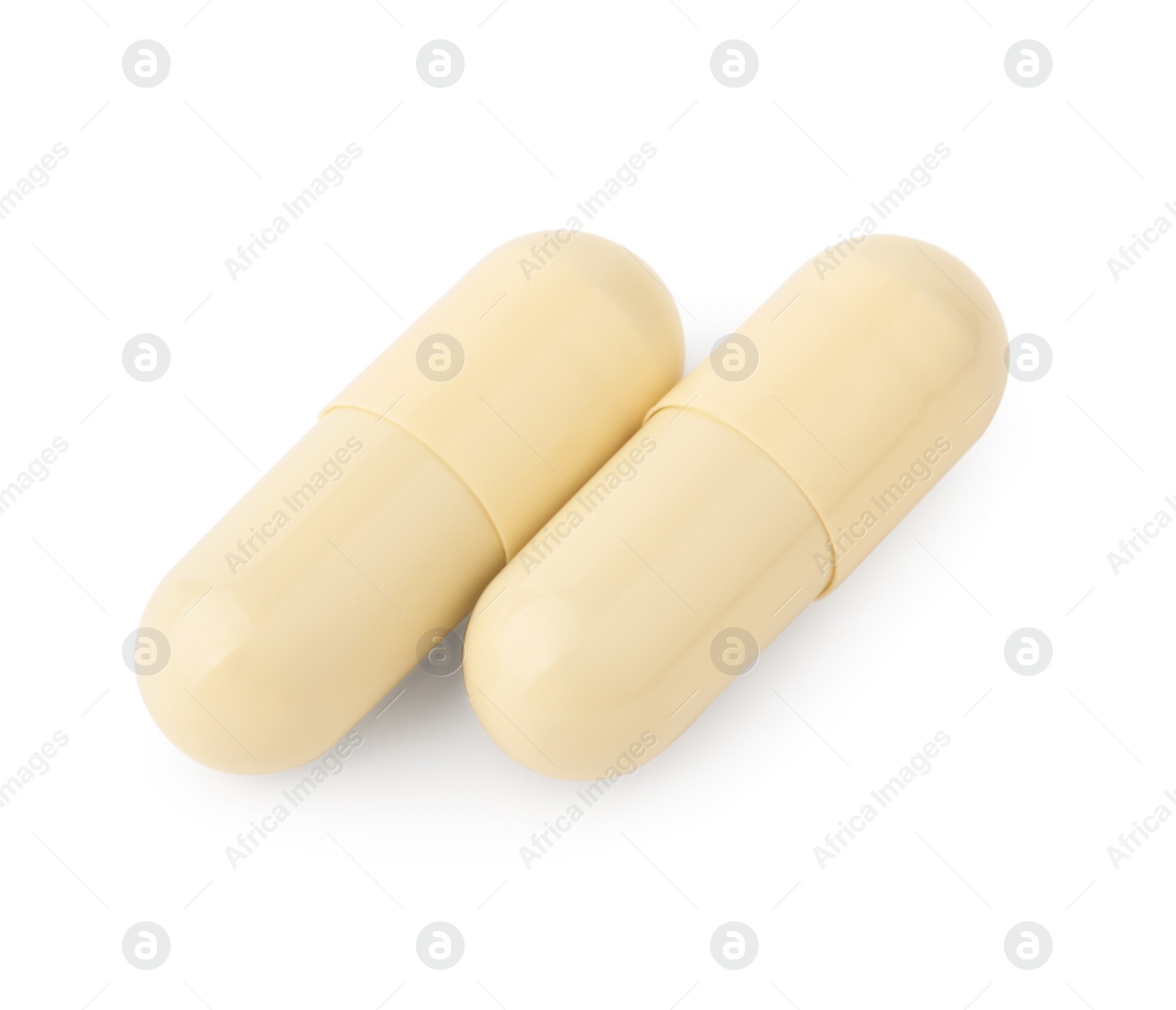 Photo of Vitamin capsules isolated on white, top view