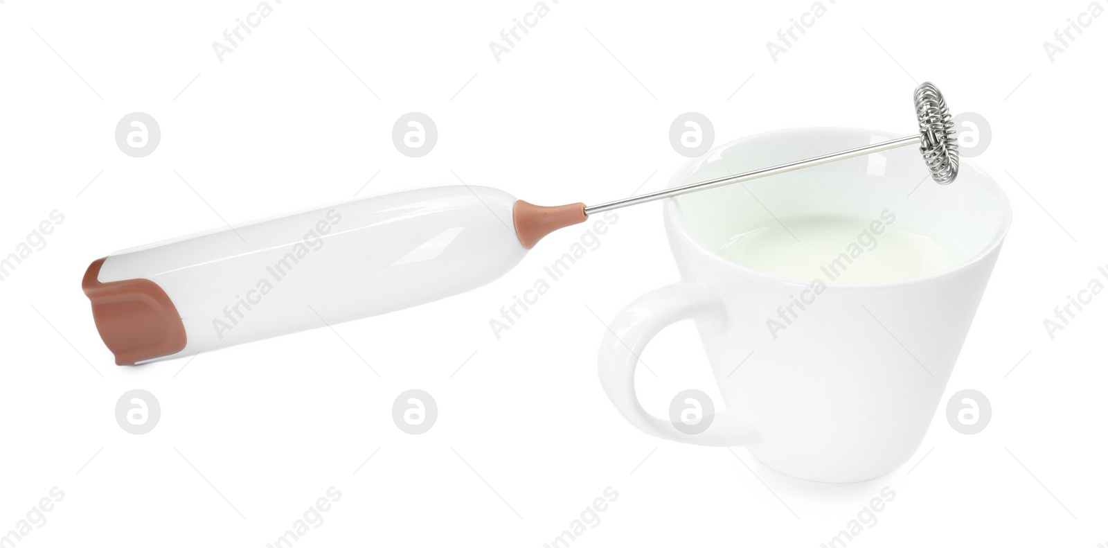 Photo of Milk frother wand and cup isolated on white