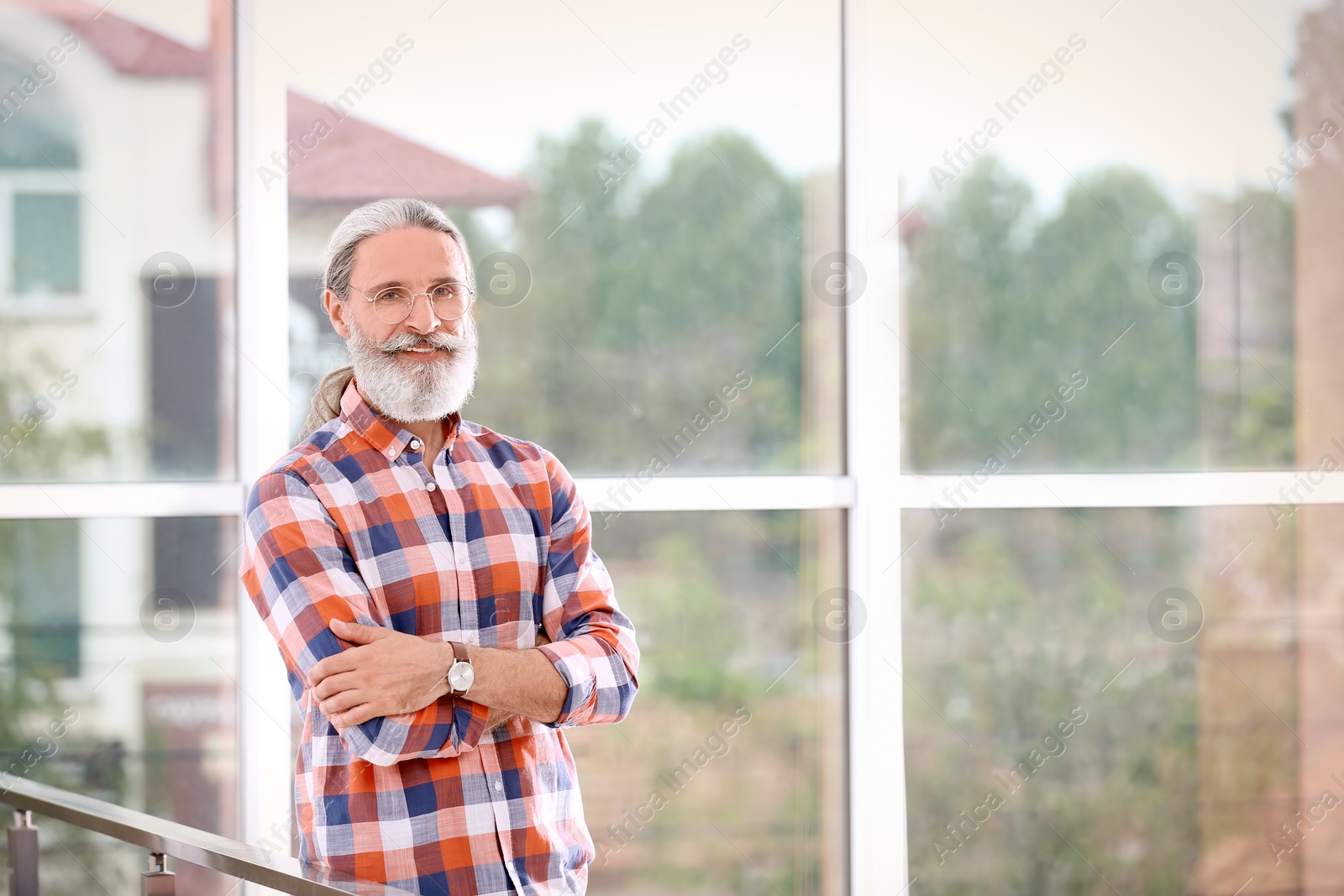 Photo of Portrait of handsome bearded mature man, indoors