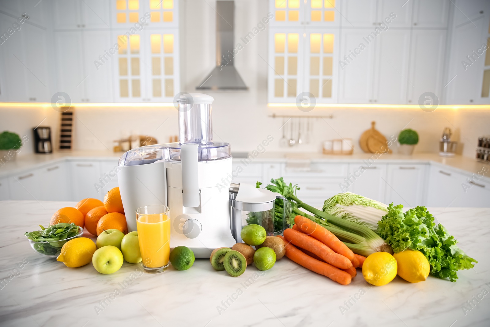 Photo of Modern juicer, fresh vegetables and fruits on table in kitchen