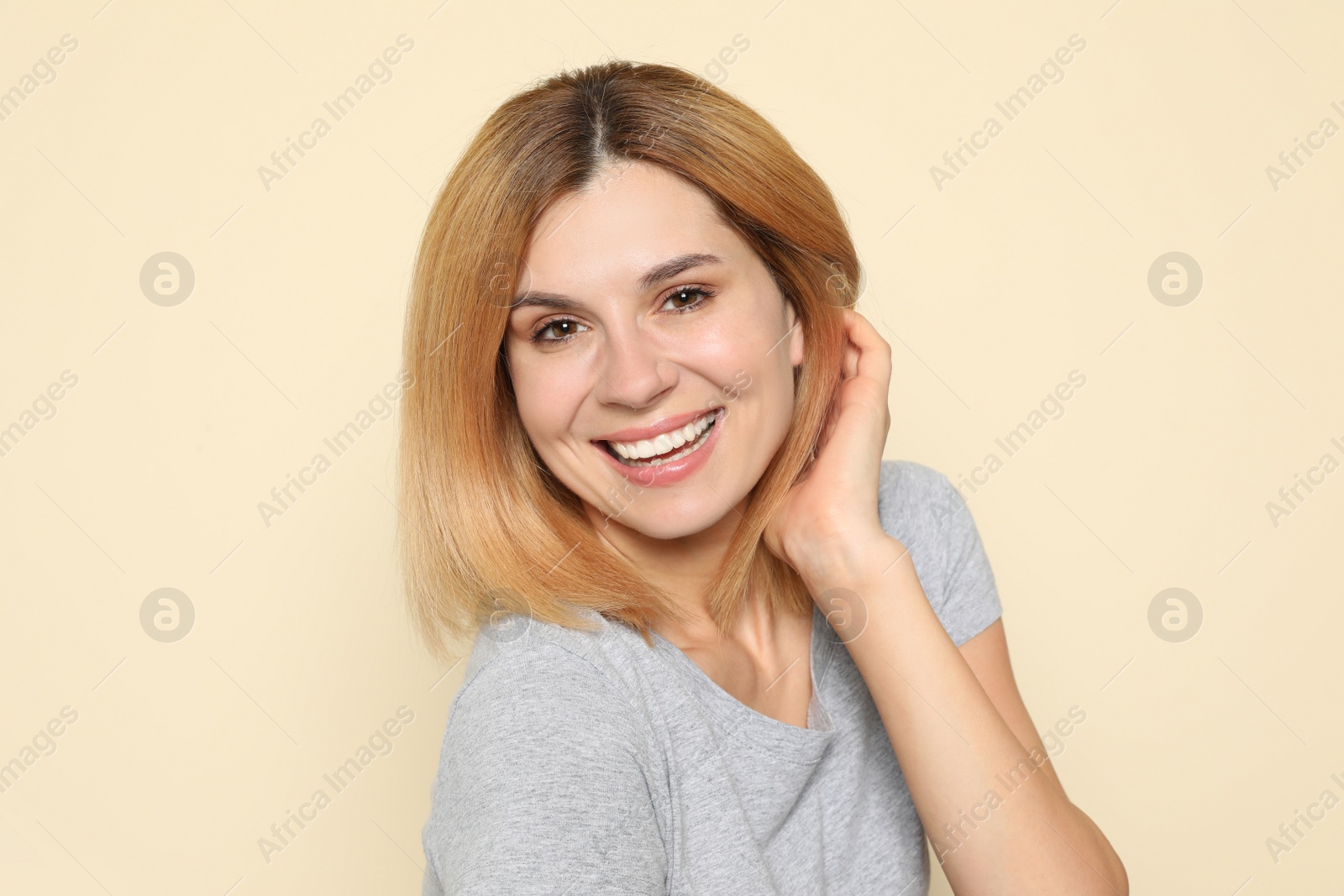 Photo of Portrait of woman with beautiful face on beige background