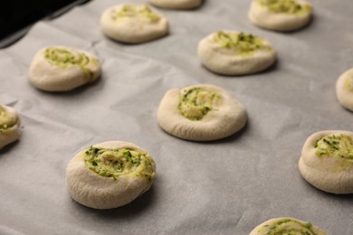 Raw puff pastry with tasty filling, closeup