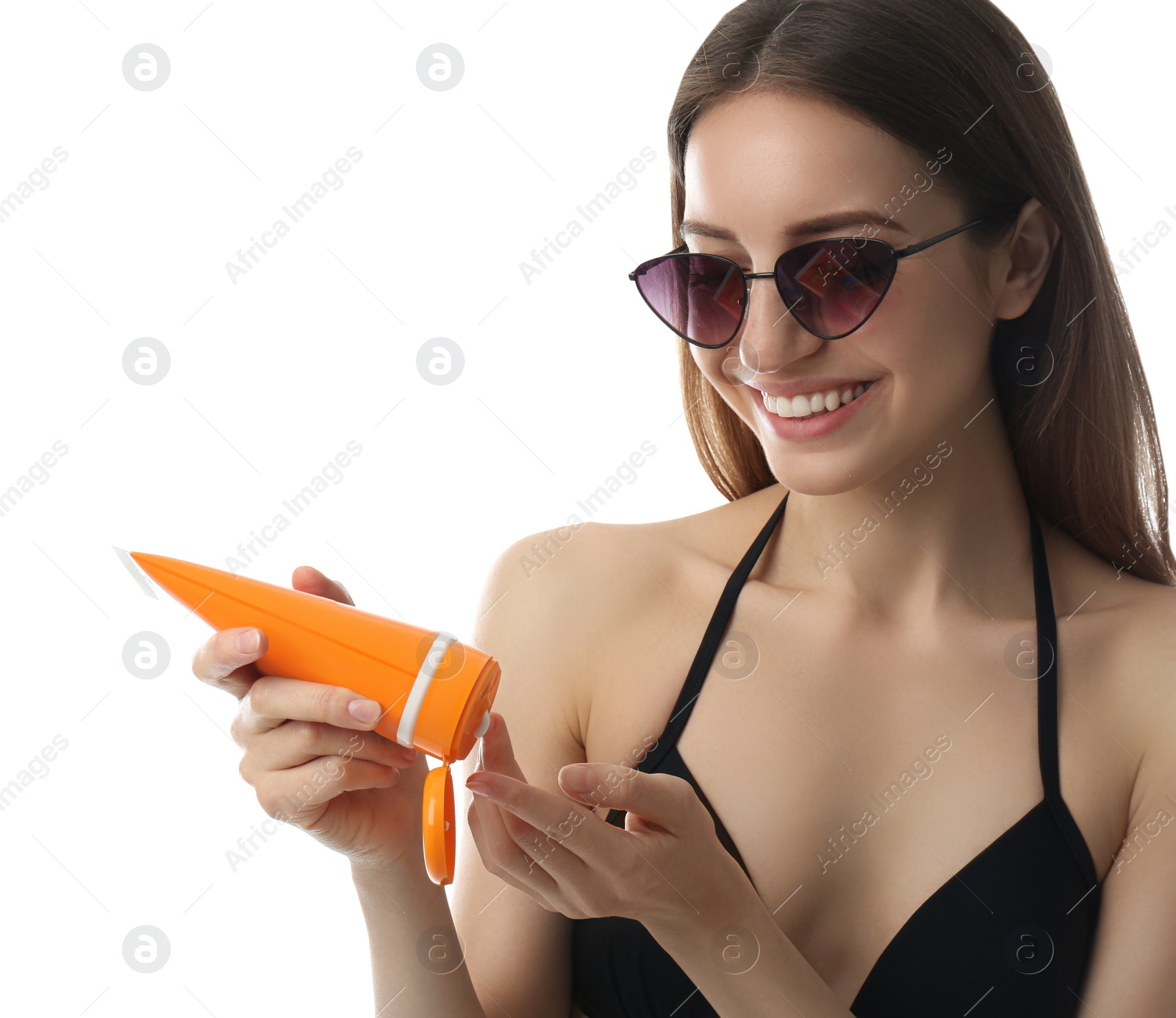 Photo of Young woman applying sun protection cream on white background