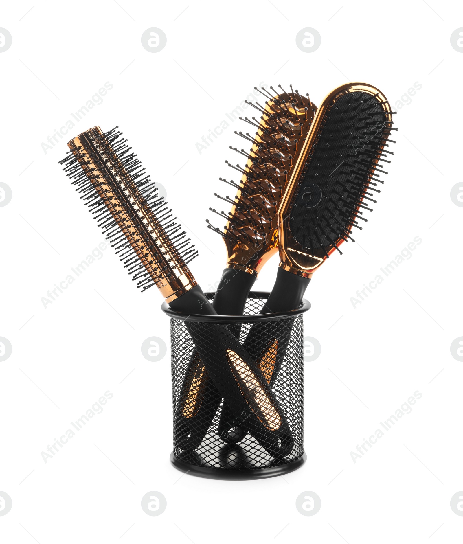 Photo of New modern hair brushes in metal holder isolated on white