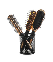 New modern hair brushes in metal holder isolated on white