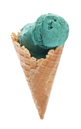 Photo of Spirulina ice cream cone on white background