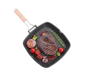 Photo of Grill pan with delicious fried beef meat, spices and vegetables isolated on white, top view