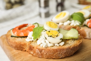 Photo of Cutting board with delicious bruschetta, closeup view