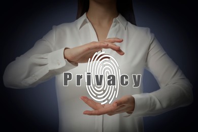 Privacy policy. Woman holding illustration of fingerprint against dark background, closeup