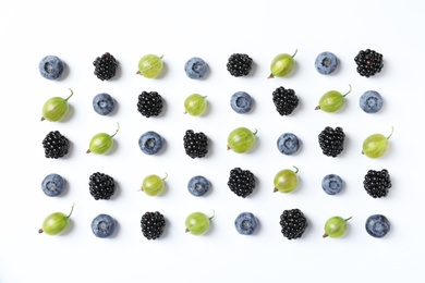 Photo of Composition with gooseberries, blackberries and blueberries on white background