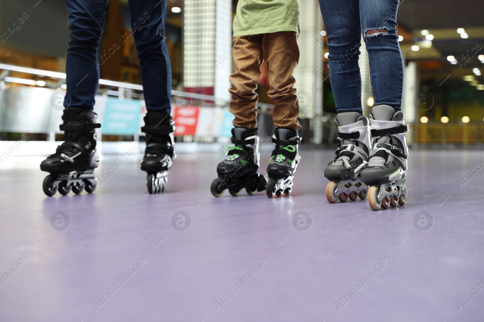 Photo of Family at roller skating rink, closeup view