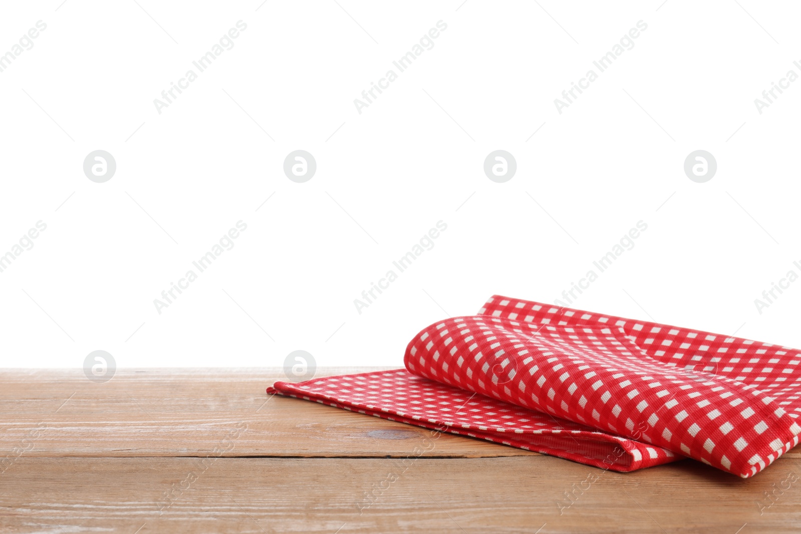 Photo of Red checkered napkins on wooden table against white background. Mockup for design