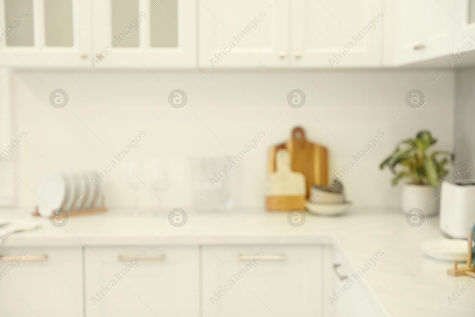 Photo of Blurred view of modern kitchen. Interior design