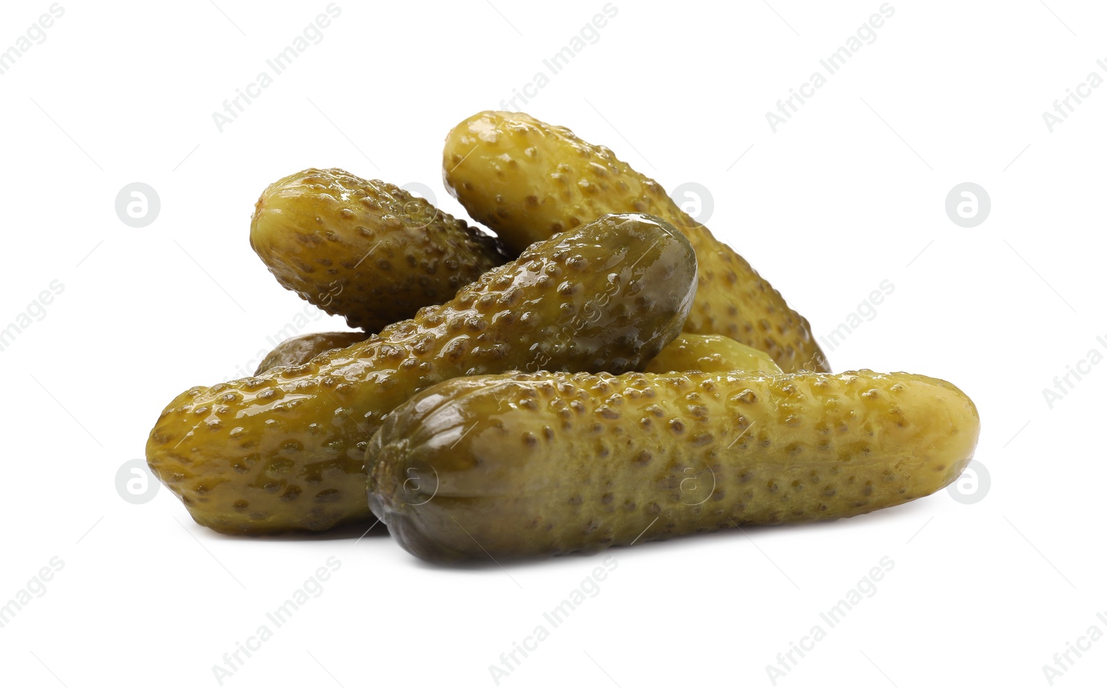 Photo of Pile of tasty pickled cucumbers isolated on white