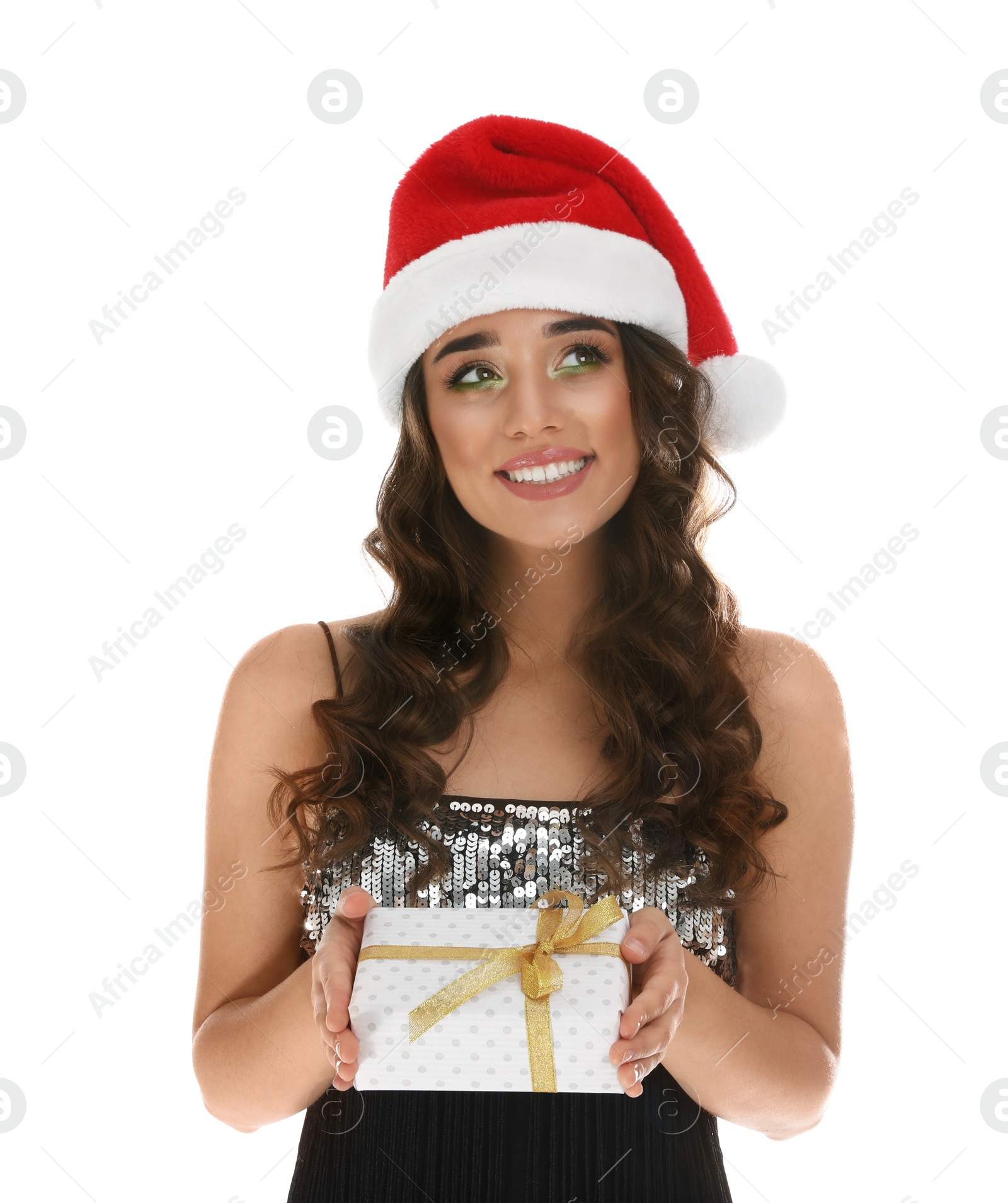 Photo of Beautiful woman in Santa hat with Christmas gift on white background