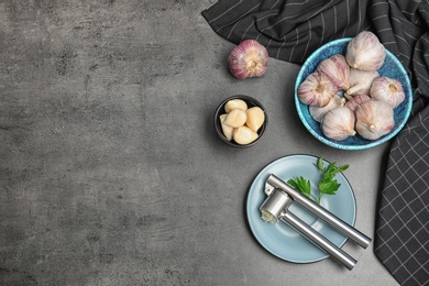 Photo of Flat lay composition with garlic press on table