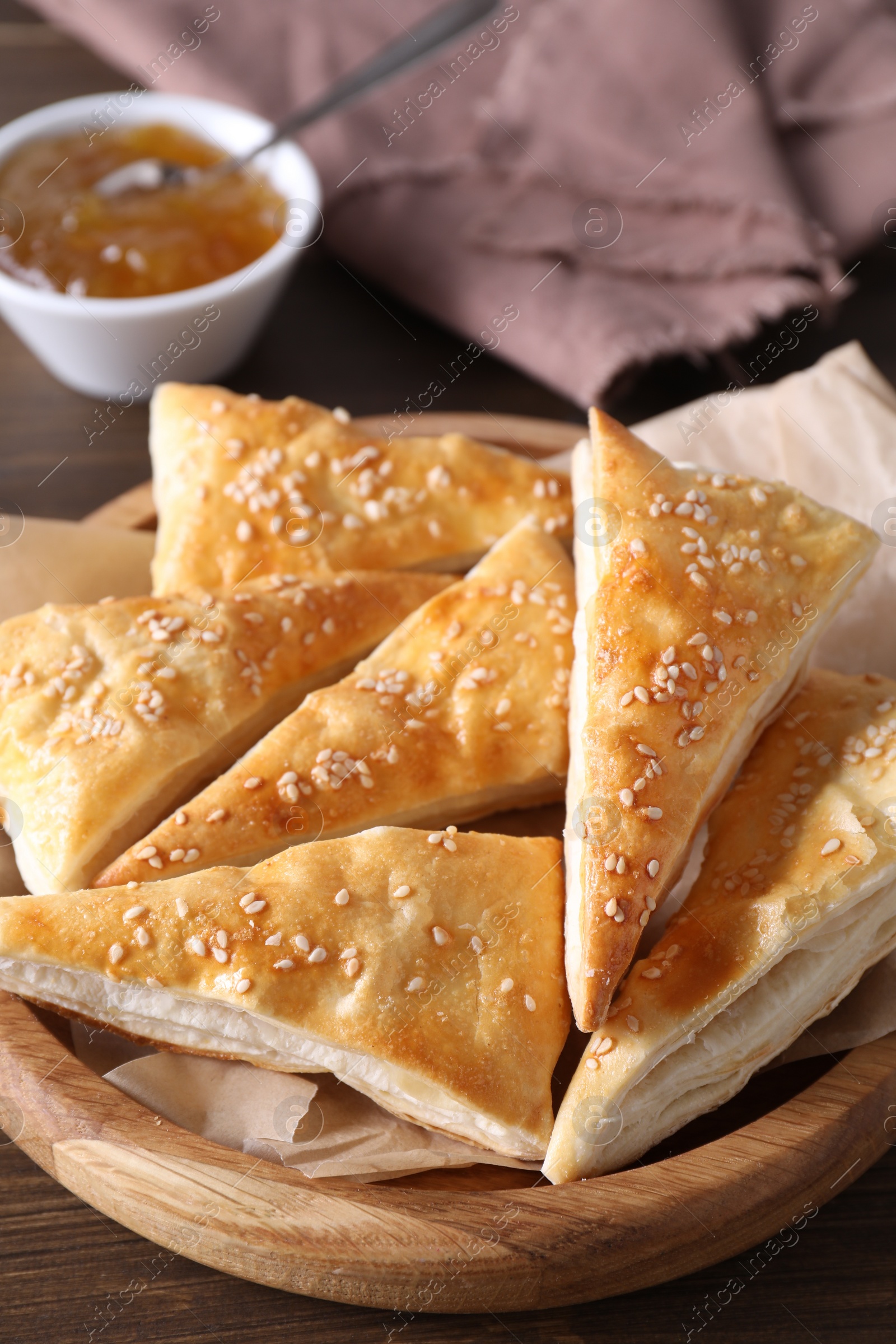 Photo of Delicious puff pastry on wooden table, closeup