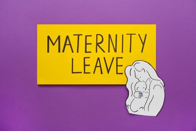 Photo of Maternity leave concept. Note with paper cutout of mother and child on purple background, top view