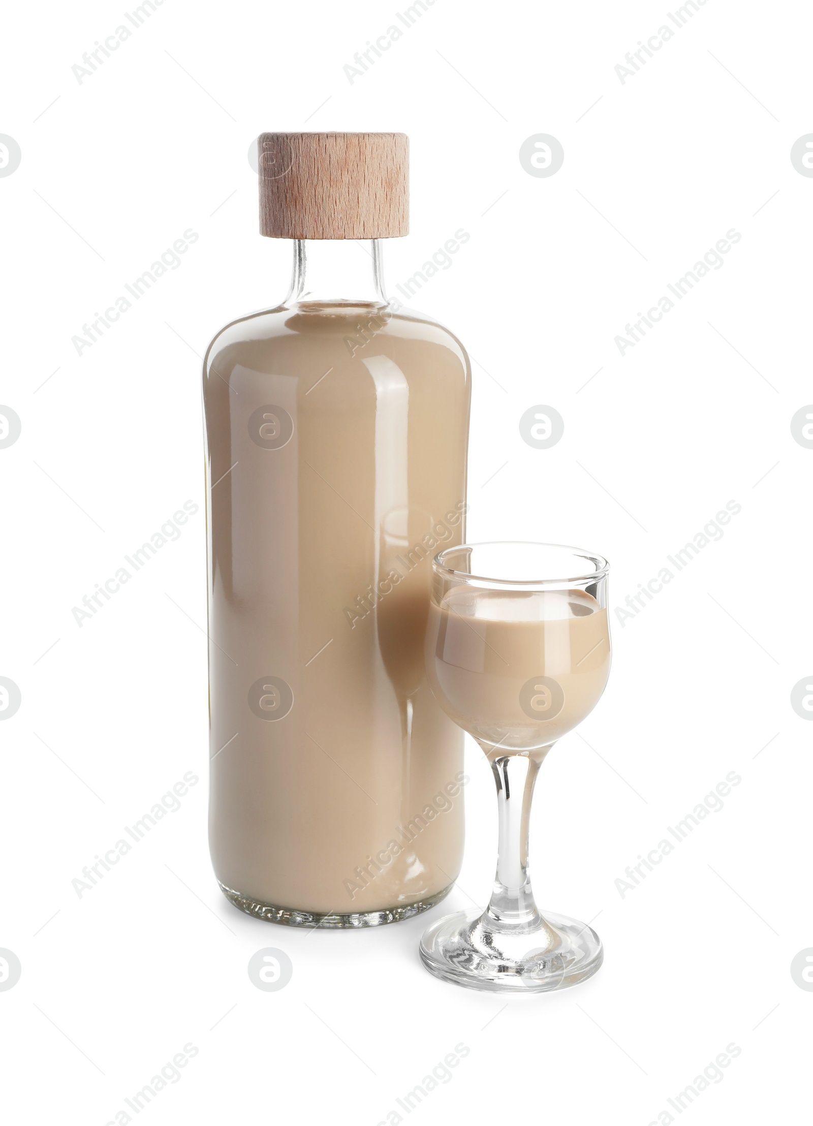 Photo of Bottle and glass of coffee cream liqueur isolated on white