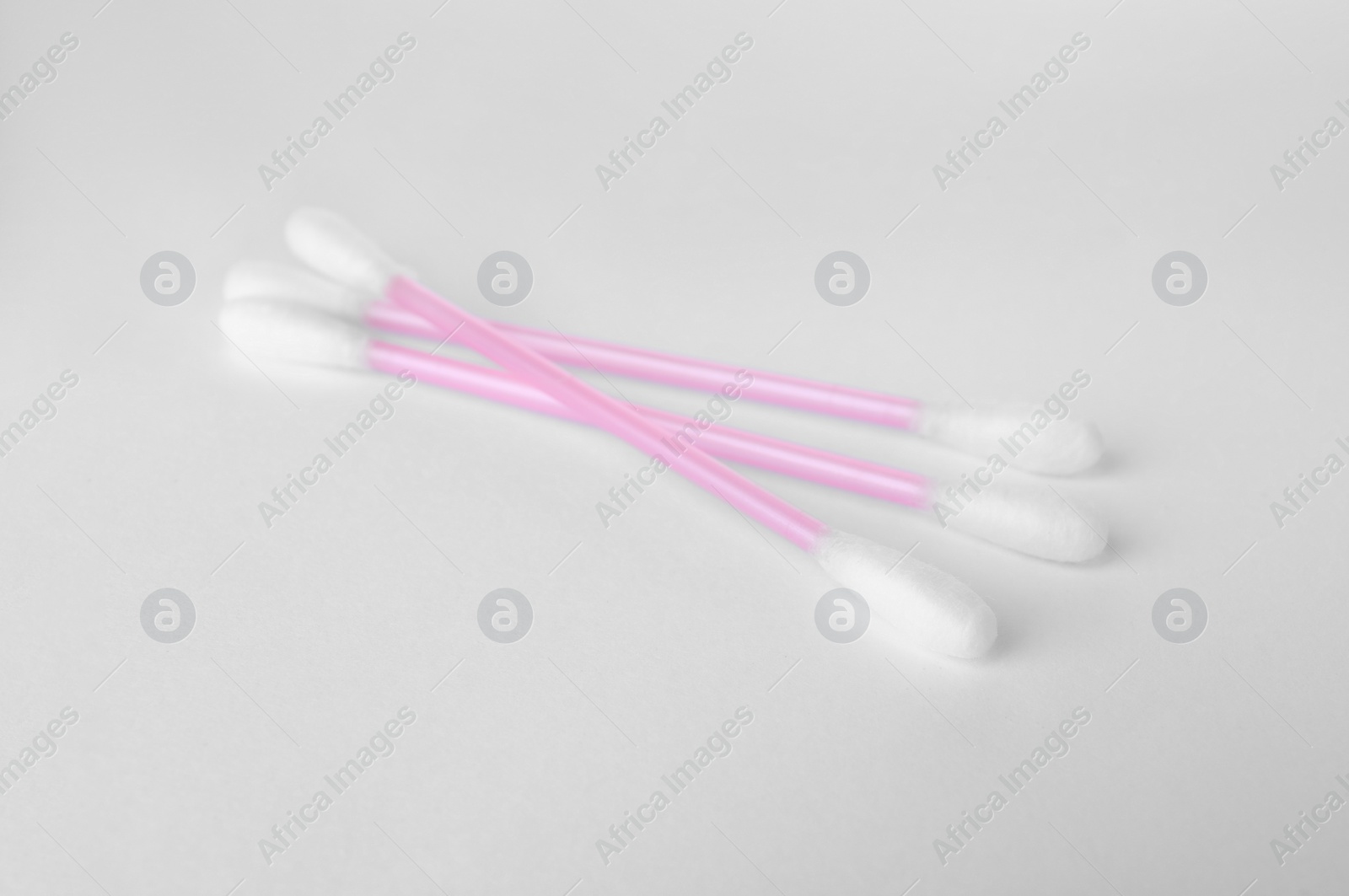 Photo of Clean cotton buds isolated on white. Hygienic product