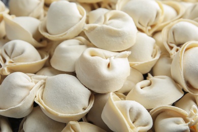 Photo of Raw dumplings as background, closeup. Home cooking