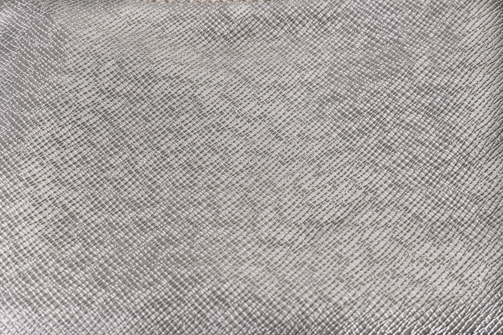 Photo of Closeup view of silver fabric as background