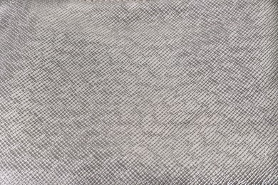 Photo of Closeup view of silver fabric as background