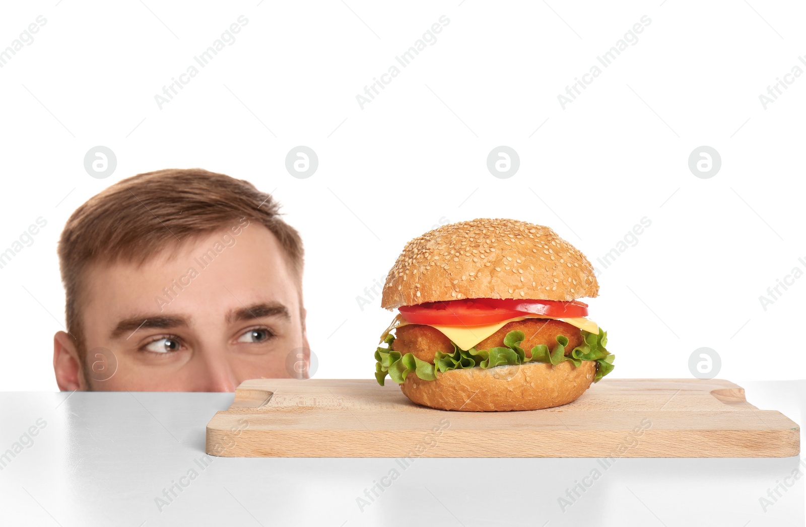 Photo of Young man and tasty burger on white background