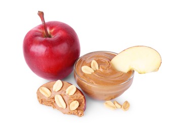 Photo of Slices of fresh apple with peanut butter, fruit and nuts isolated on white