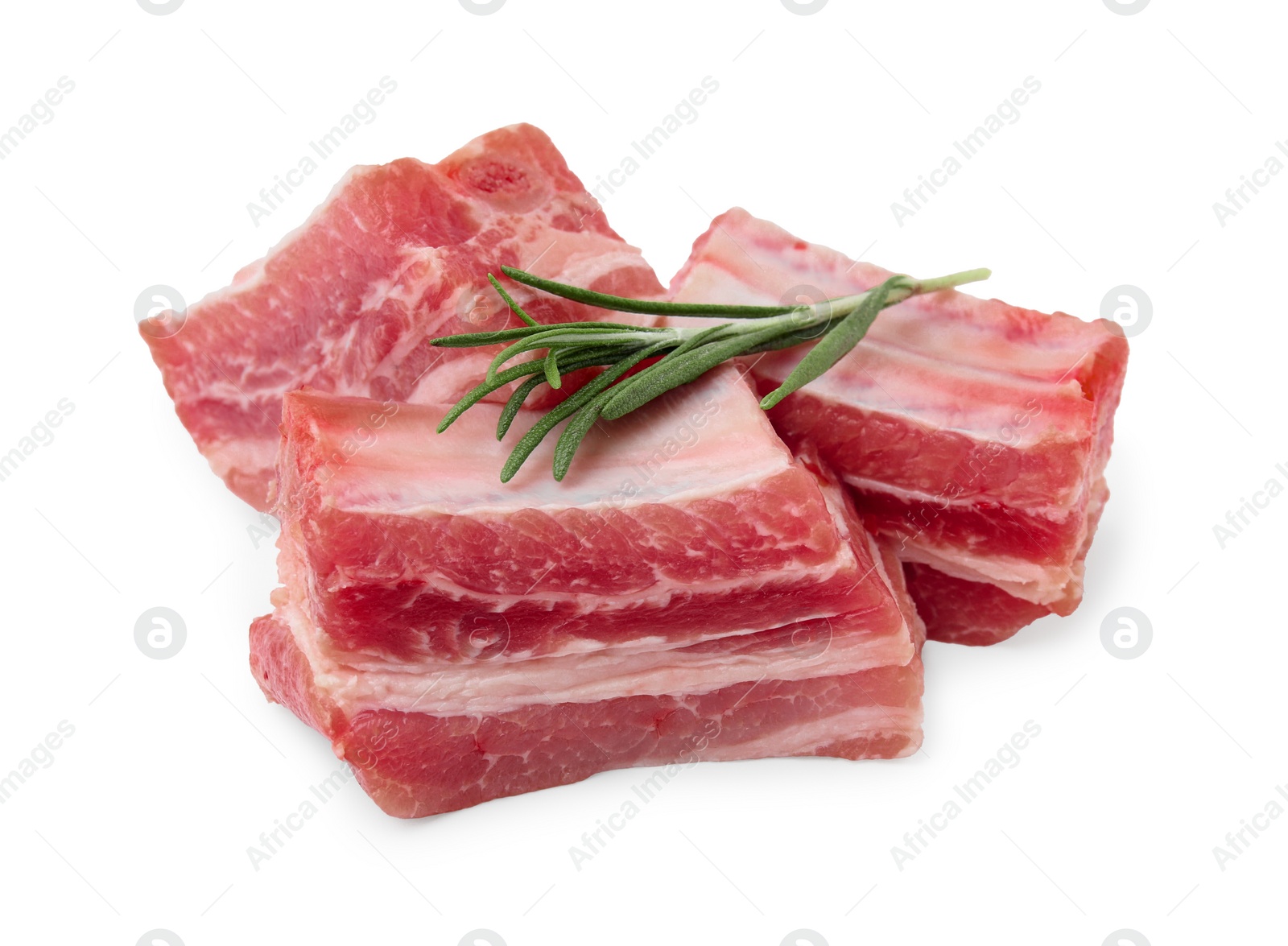 Photo of Cut raw pork ribs with rosemary isolated on white