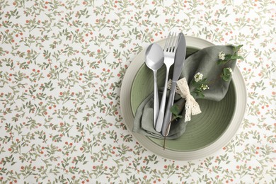 Photo of Stylish setting with cutlery, plates, napkin and floral decor on table, top view. Space for text