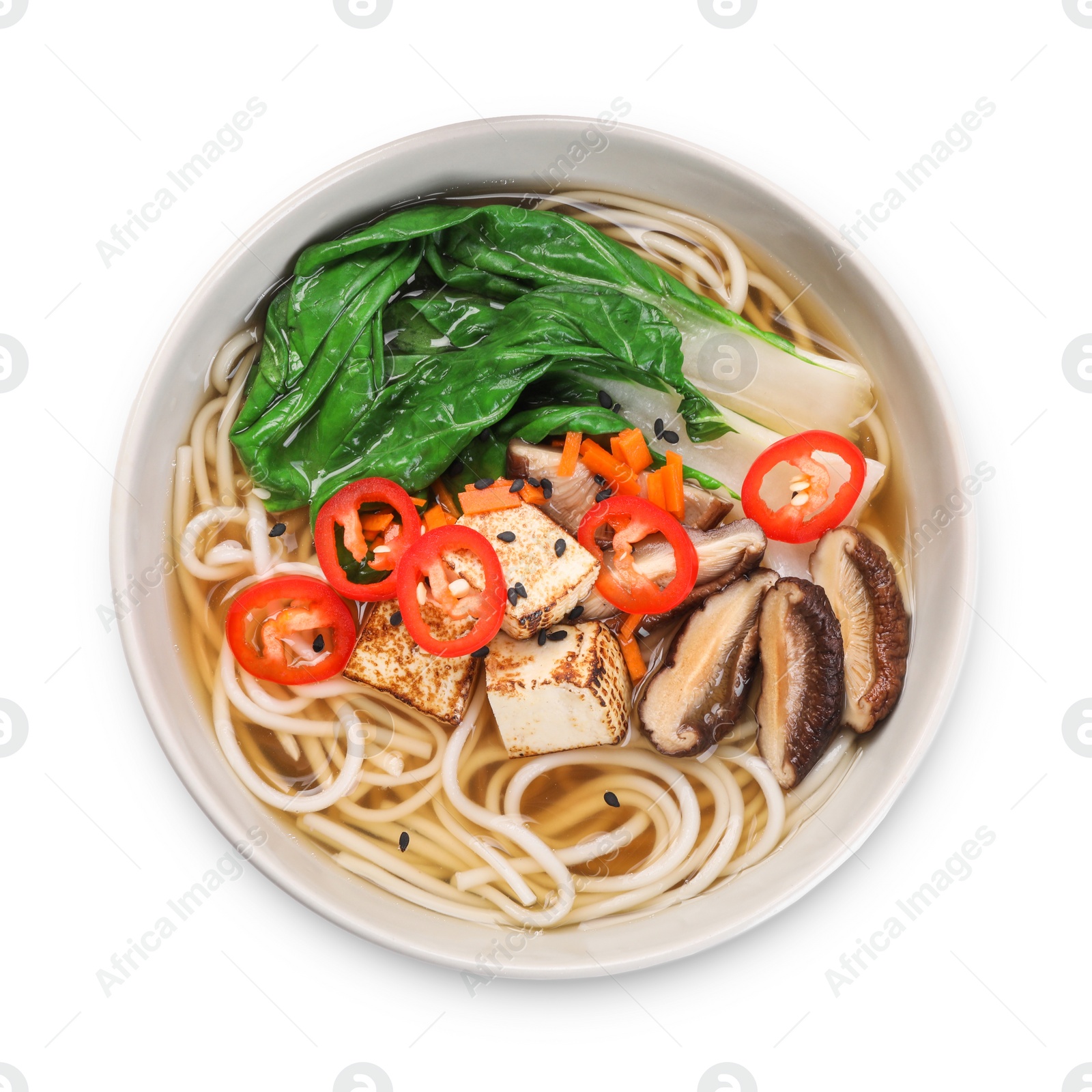 Photo of Bowl of vegetarian ramen isolated on white, top view